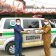 Kepala Desa Kampung Sawah Edi Riyadi berfoto saat menerima surat pembelian mobil ambulance